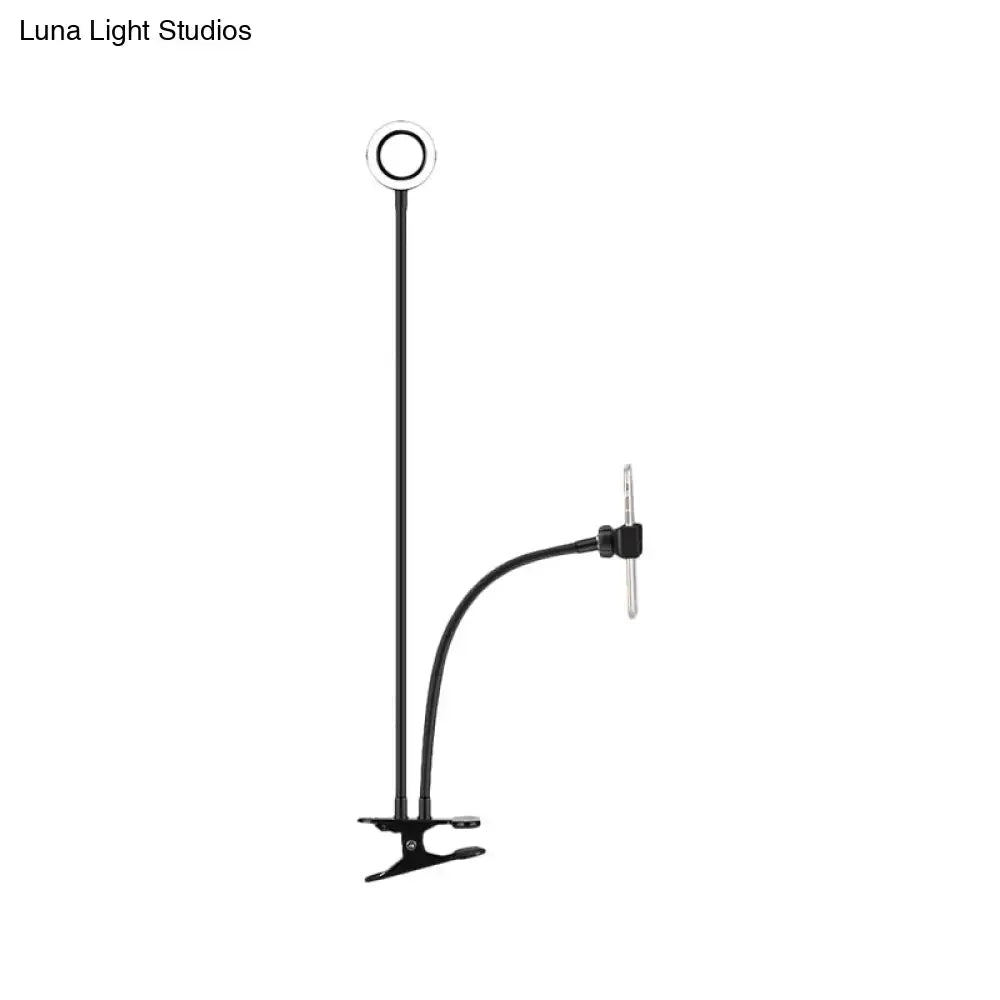 Black adjustable metal round usb mirror lamp with flexible arm and clip base for bedroom use