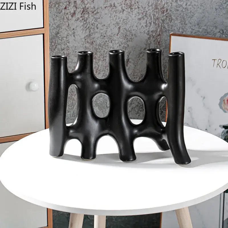Modern black and white decorbites ceramic vase with five slender interconnected openings and sculptural curves for living room decor