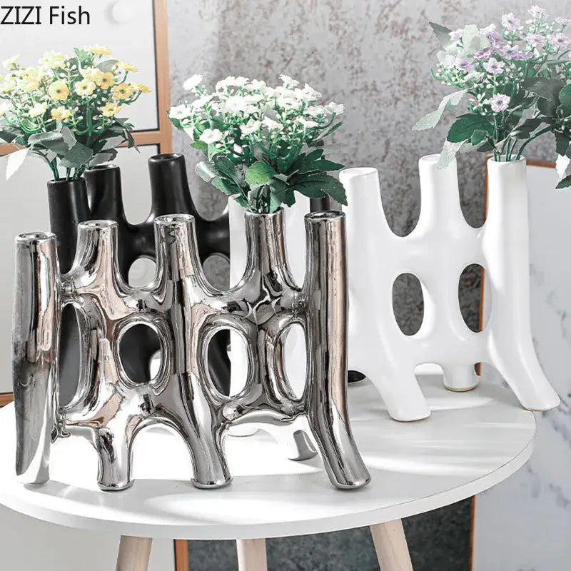Shiny silver ceramic vase with modern abstract vertical openings for living room decor by decorbites ceramic vase