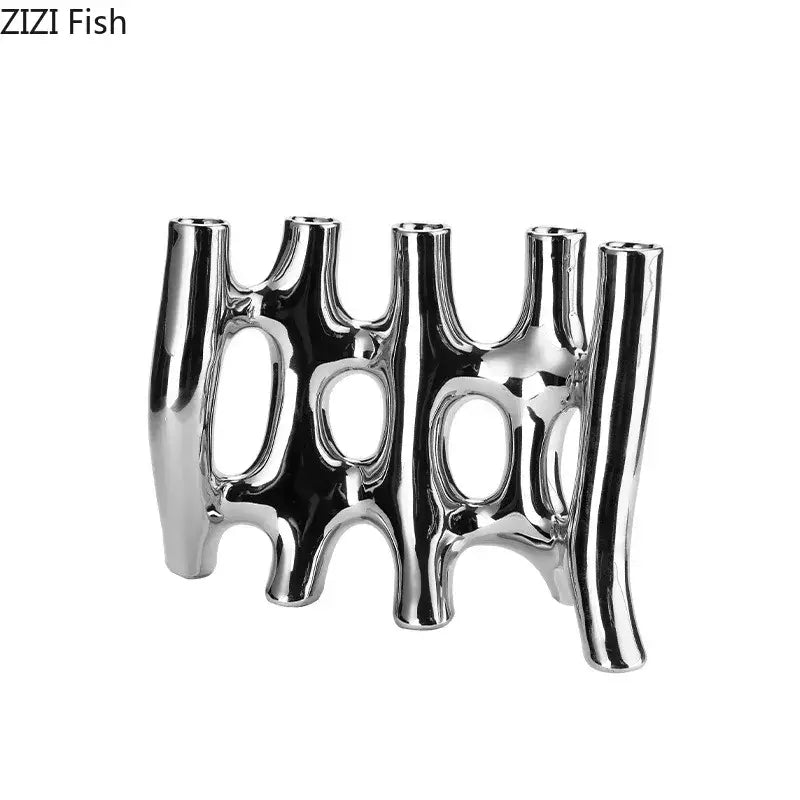 Modern black and white decorbites ceramic vase featuring shiny silver abstract tubular design for living room decor