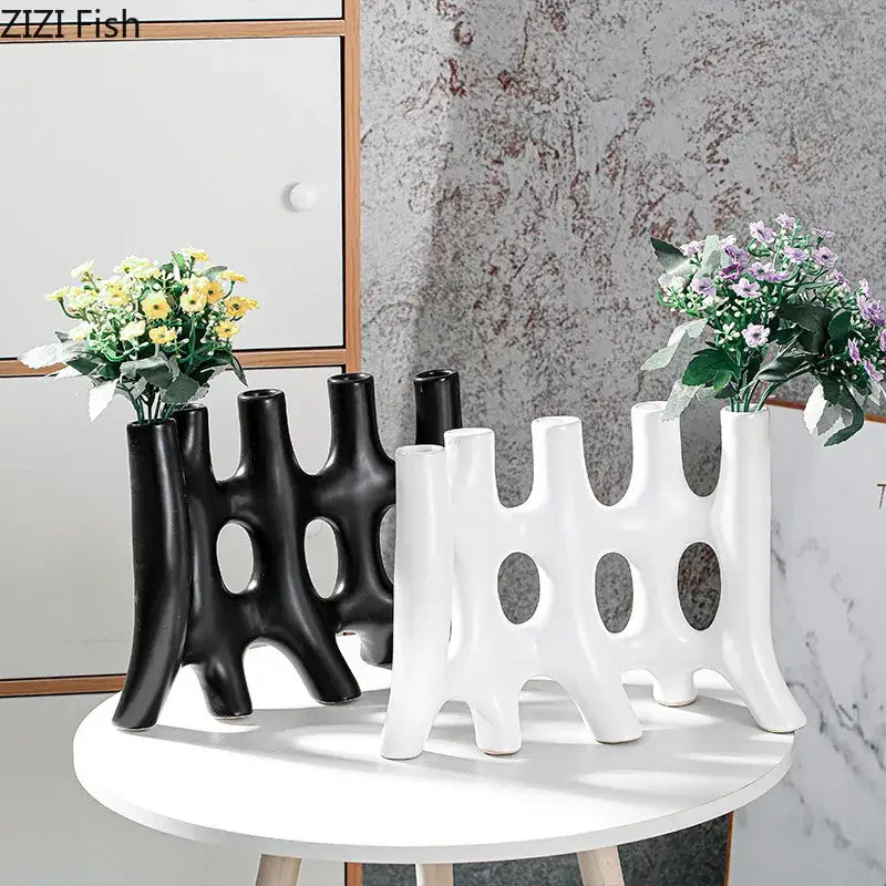 Modern black and white ceramic vase with sculptural tree like design and oval cutouts decorbites ceramic vase decor
