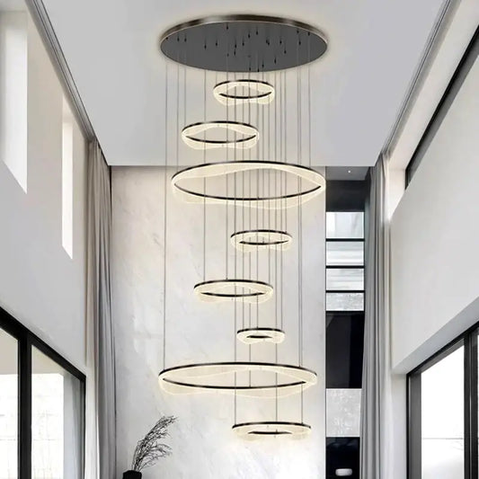 Modern black and white sculptural ring pendant light with concentric rings for living room illumination