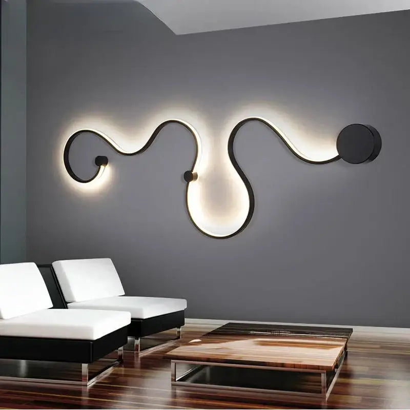 Modern black metal wall lamp with flowing sculptural curves and warm ambient lighting for decorbites contemporary acrylic wall use