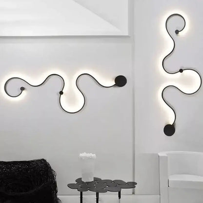 Modern black wrought iron wall lamps with glowing serpentine light trails for bedroom decorbites contemporary acrylic wall