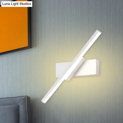 Modern black and white slim led wall sconce with sleek angular design and minimalist rectangular base for bedroom lighting