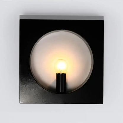 Modern black and white square wall lamp with frosted glass globe and medium base exposed bulb in a inches fixture