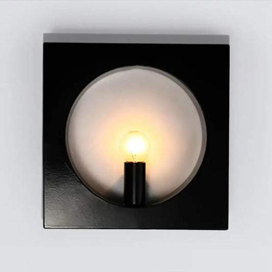 Modern black and white square wall lamp with frosted glass globe and medium base exposed bulb in a inches fixture