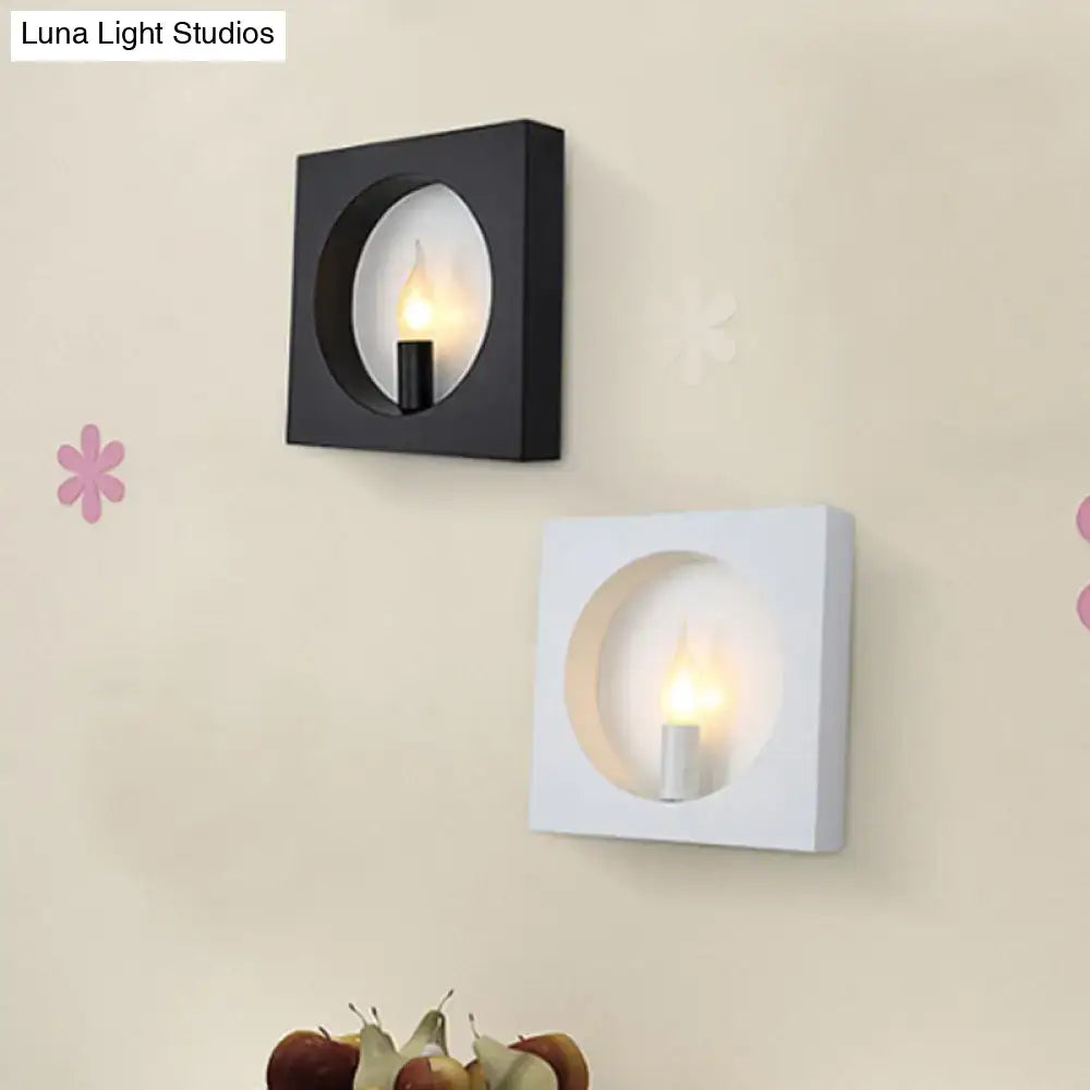 Modern black and white square wall lamp with circular cutouts and medium base candle bulbs for bedroom use inches fixture