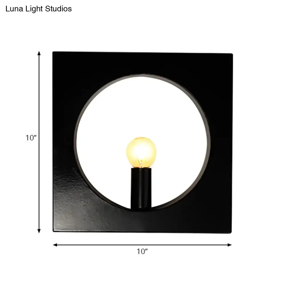 Modern black wall lamp with glass globe fixture and circular cutout framing illuminated medium base bulb inches fixture