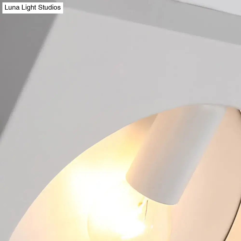 Modern black and white square wall lamp with white cylindrical glass globe fixture and warm glowing bulb medium base inches fixture