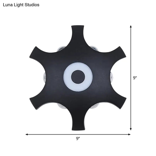 Modern black 9-inch star shaped led wall light fixture with central white accent and warm white light for bedroom use