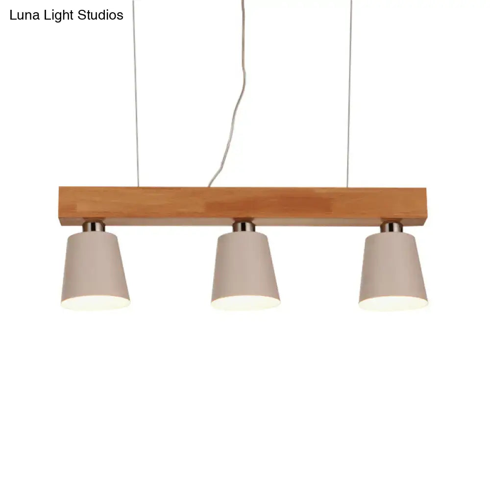 DecorBites™ modern tapered indoor ceiling light with three beige fabric shades, black white accents, and wooden beam