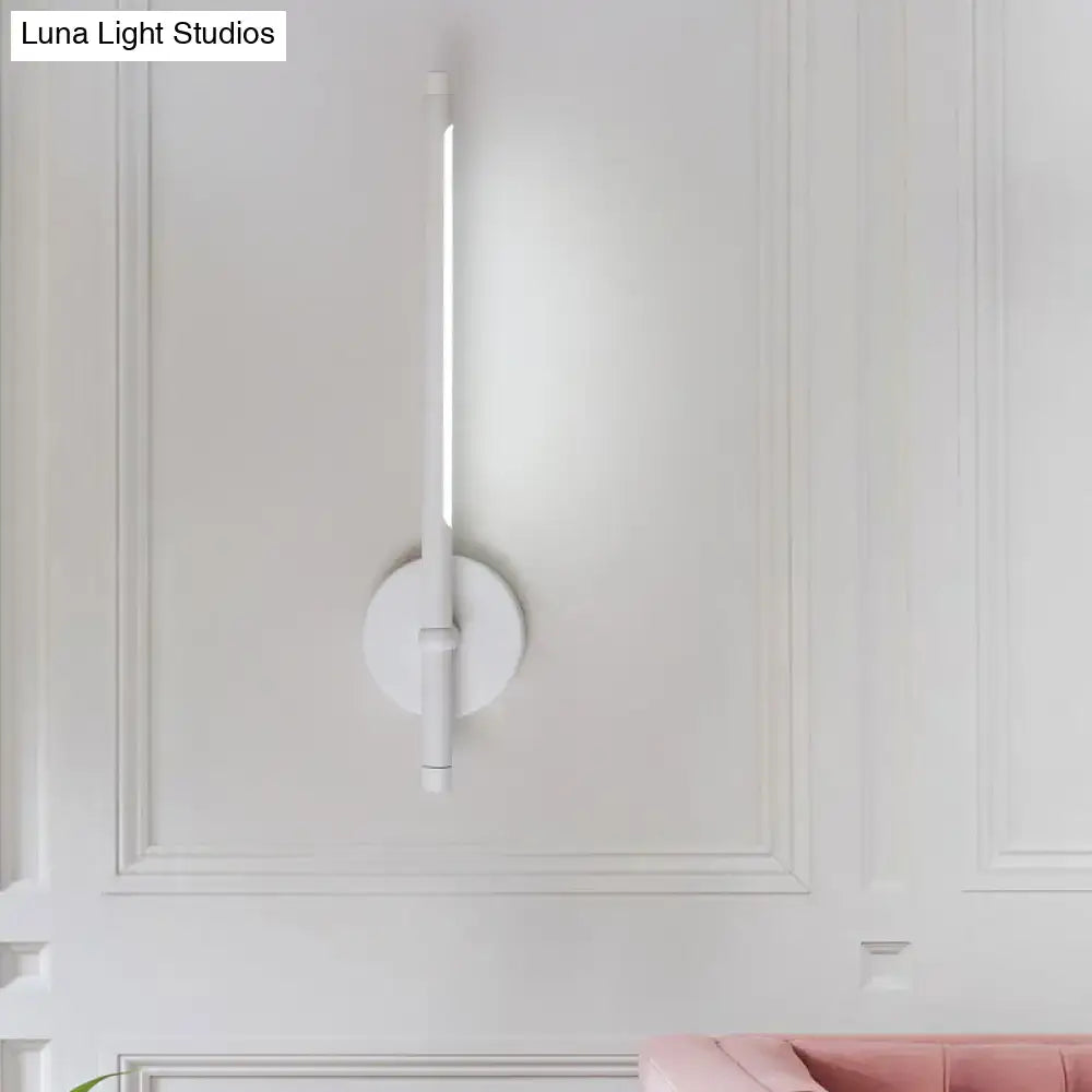 White minimalist modern direct wired wall sconce with tubular led light and circular base for bedroom use maximum bulb wattage