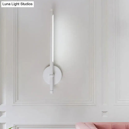 White minimalist modern direct wired wall sconce with tubular led light and circular base for bedroom use maximum bulb wattage