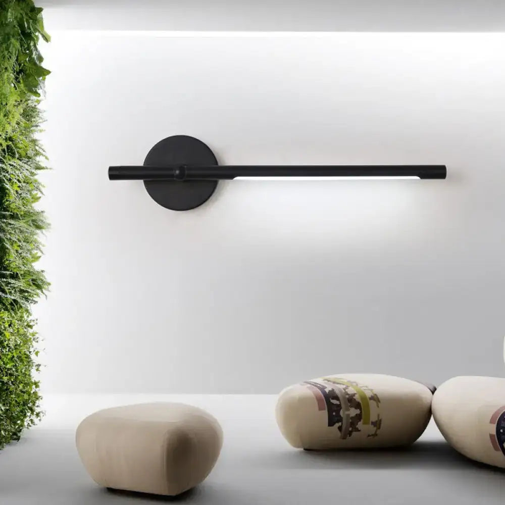 Modern black and white tubular led sconce featuring a direct wired black minimalist wall sconce with circular base and maximum bulb wattage