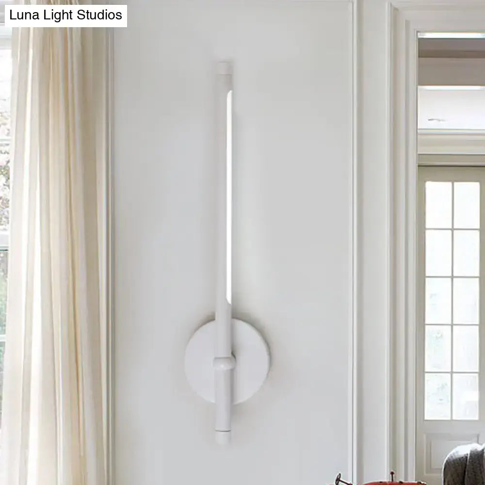 White minimalist tubular led sconce with direct wired installation and sleek cylindrical light tube for bedroom use