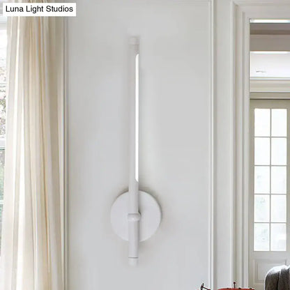 White minimalist tubular led sconce with direct wired installation and sleek cylindrical light tube for bedroom use