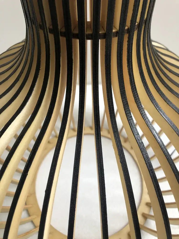 Modern black and white wood cage pendant light with curved white wood and black lacquered slats for living room