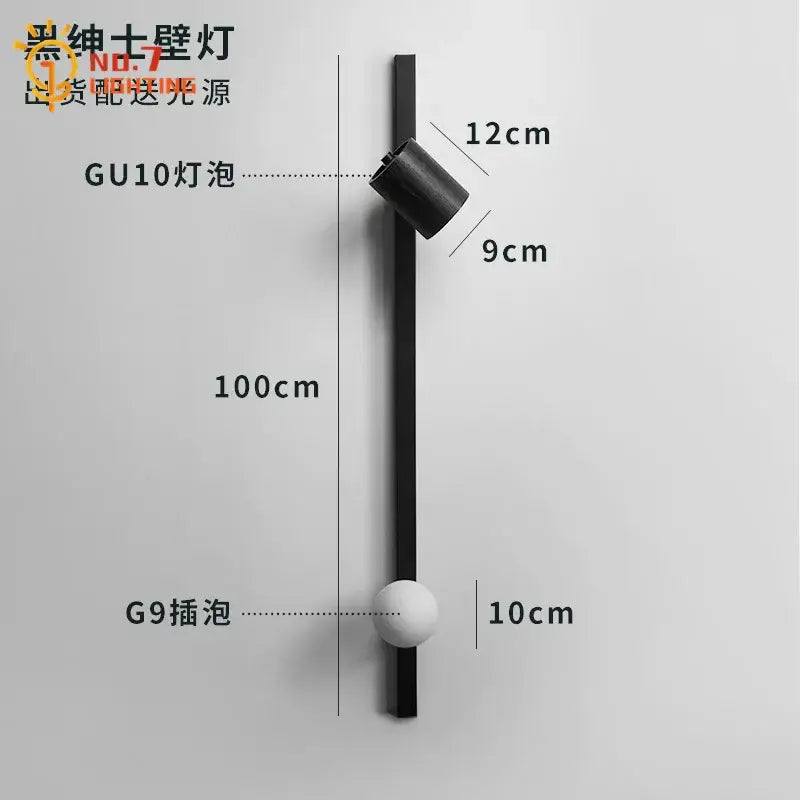 Black minimalist wall lamp with sleek vertical rod gu10 spotlight and g9 bulb holder in black white wooden decorbites style