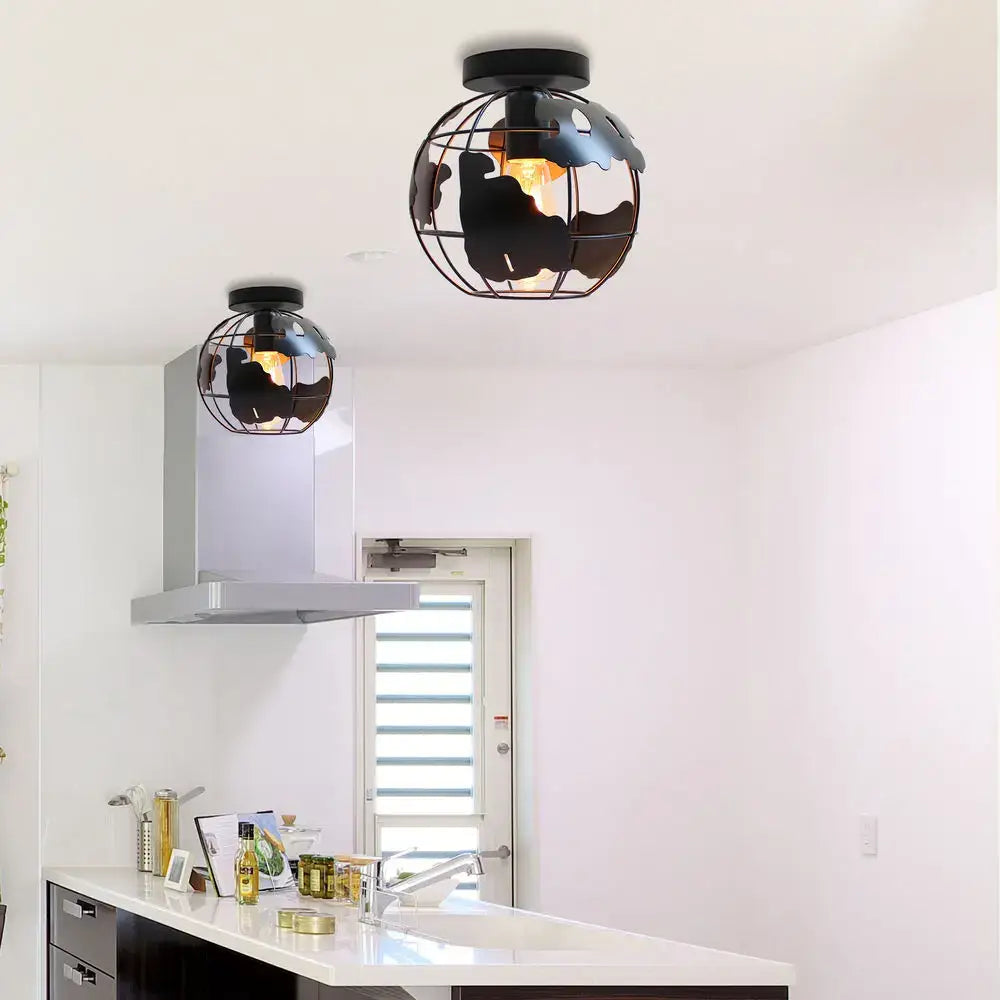 Modern black metal globe ceiling light shade with wireframe design and cutout continents for living room ceiling light
