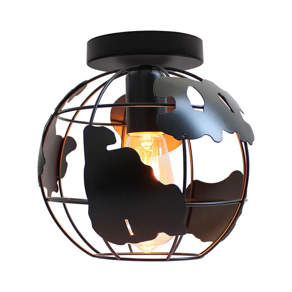 Modern black metal globe ceiling light shade with world map cutouts and exposed filament bulb for living room use