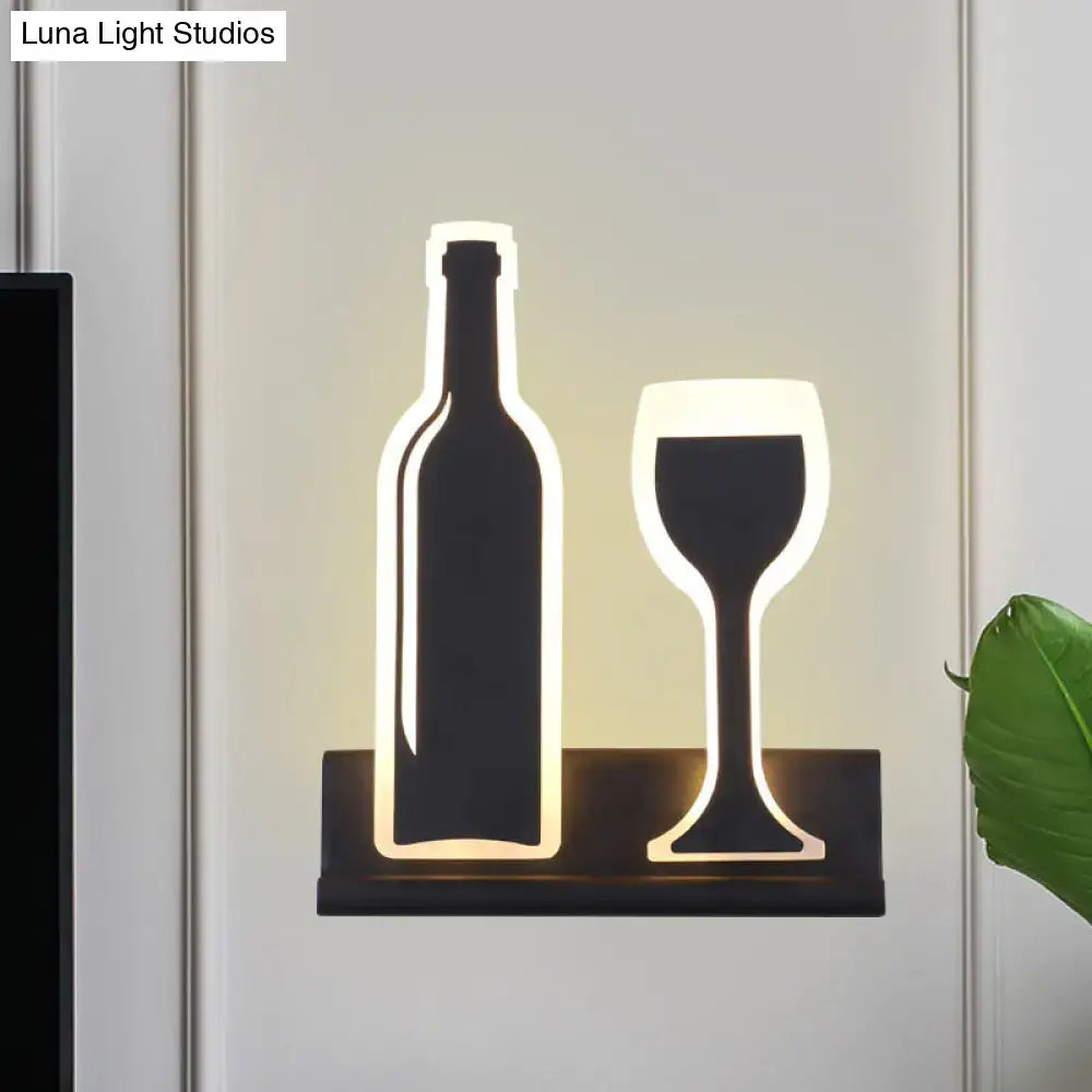 Modern black wine sconce light with illuminated bottle and glass silhouettes in sleek black frame for dining room decor fixture height