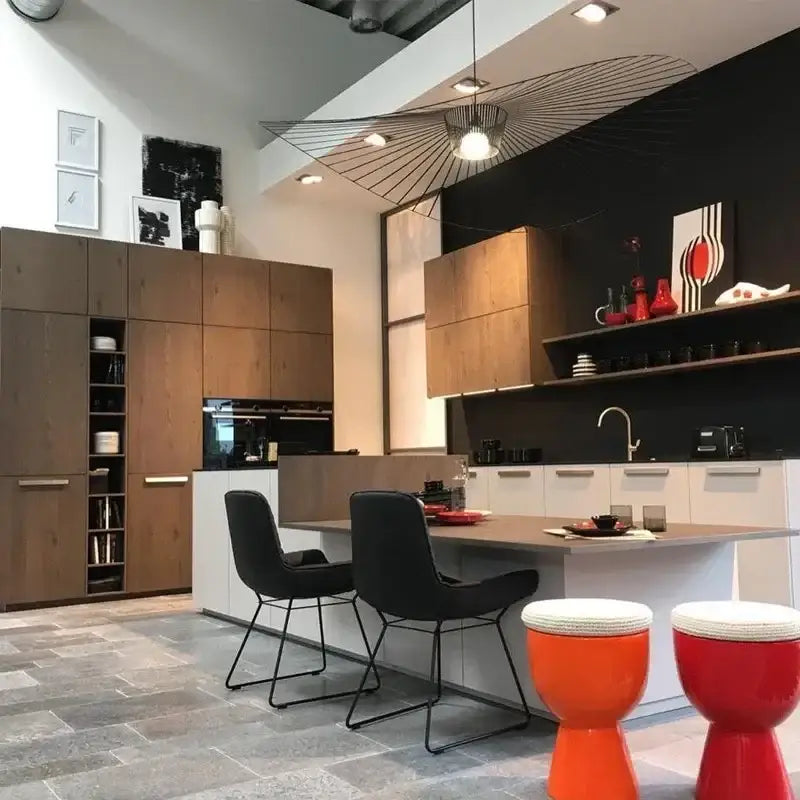 Orange and red drum-shaped stools with white woven tops complement decorbites designer pendant ceiling chandelier
