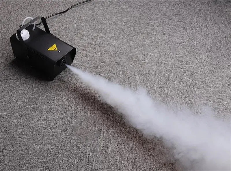 Modern black wireless fog machine pump emitting thick white mist for living room party stage use