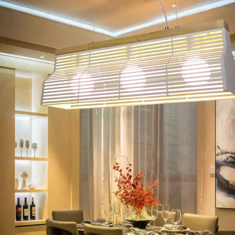 DecorBites modern black and white metal and wood island pendant light with rectangular slats and warm white illumination