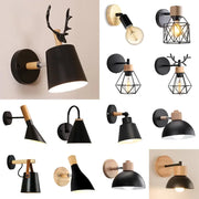Modern black wooden wall light with matte finish and antler-shaped wooden accent for living room decorbites black wooden sconce