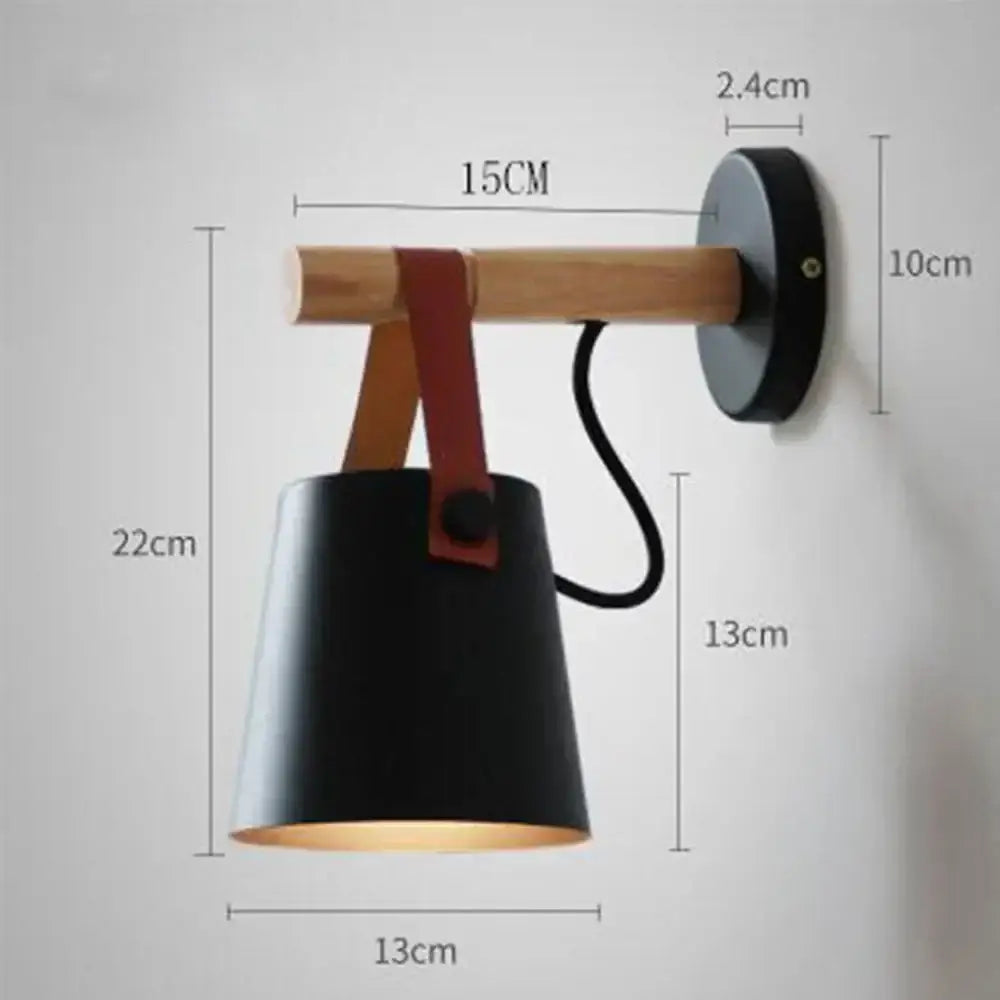 Modern black wooden wall light featuring a matte black sconce with wooden arm and red leather strap decorbites black wooden