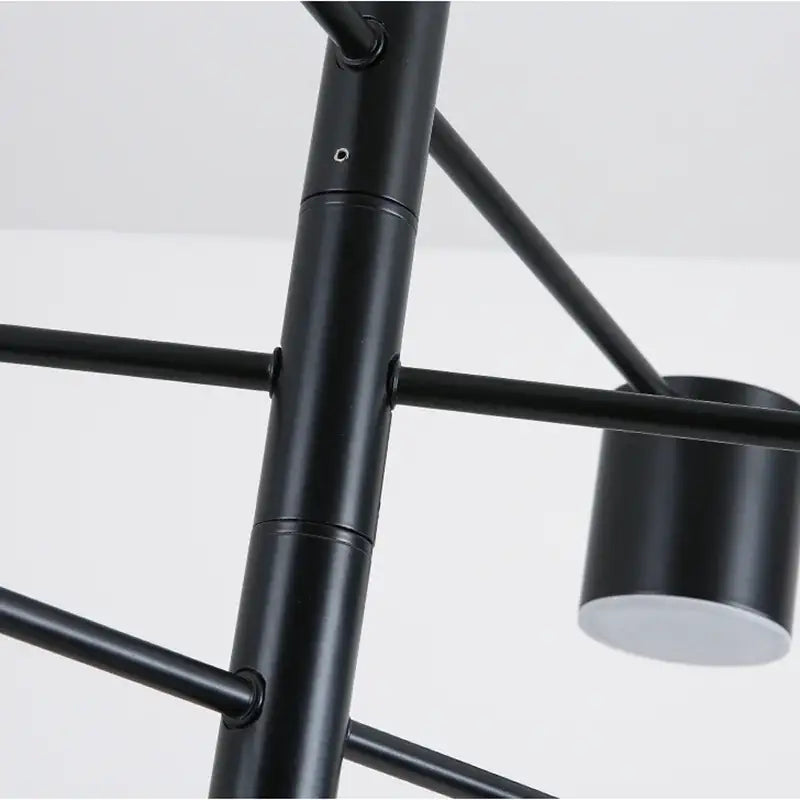 Modern black wrought iron chandelier with matte finish and cylindrical light fixtures for living room radial lighting