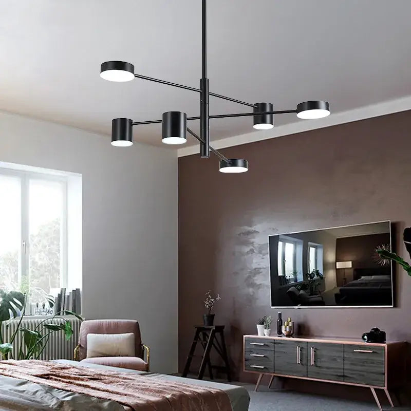 Modern black wrought iron chandelier with six cylindrical lights suspended from a central rod for living room lighting