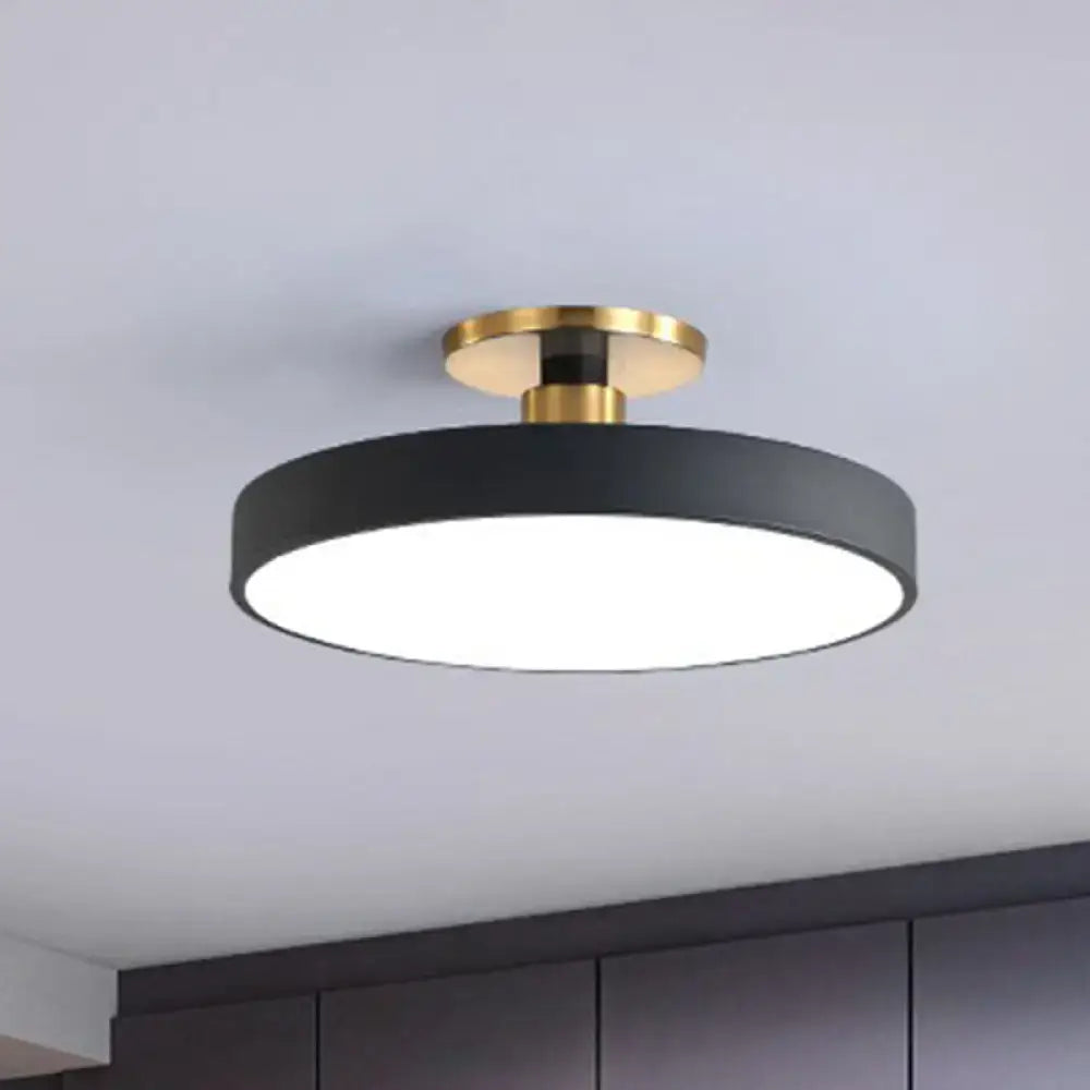 Modern black circular flush mount ceiling light with gold-toned base for nordic style interior lighting