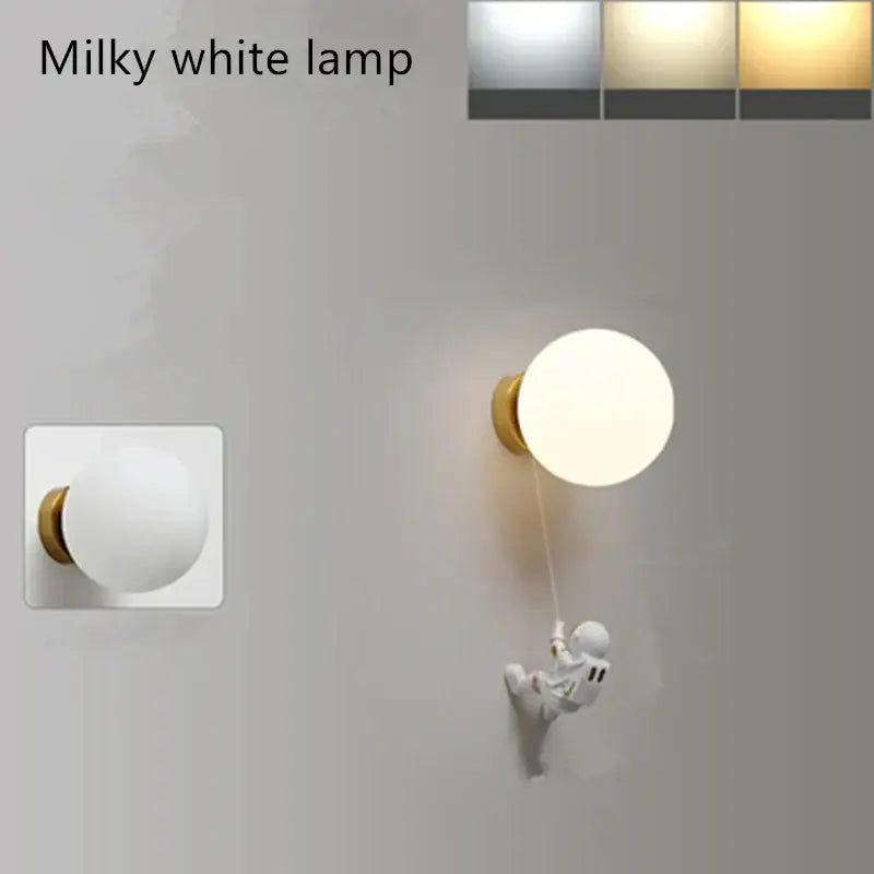 Modern blue astronaut moon wall lamp with milky white globe and gold base featuring decorbites astronaut moon figure