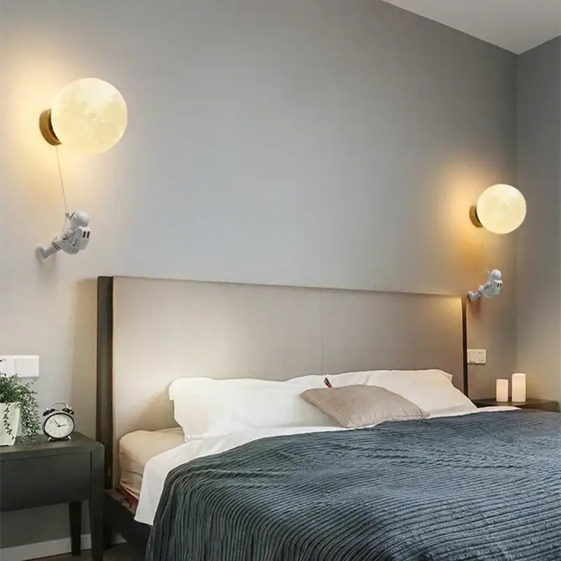 Modern blue astronaut moon wall lamp with white frosted glass globe and gold-toned decorbites astronaut moon hardware