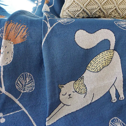 Modern blue cartoon cat woven blanket featuring a white cat with yellow-tipped ears and stylized plants for decorbites cartoon cat decorbites cartoon decor