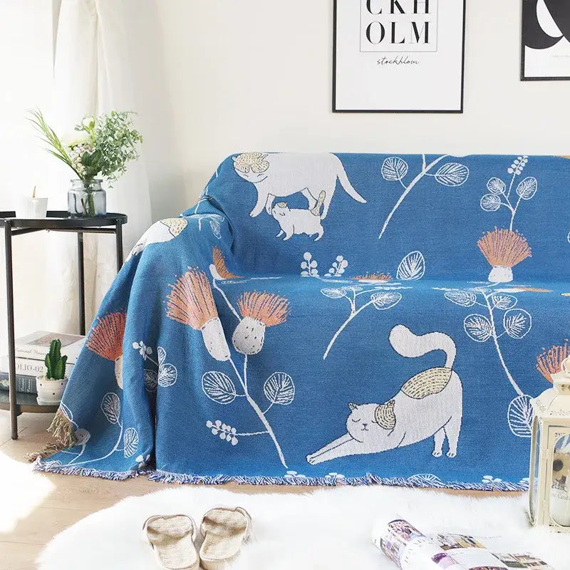 Modern blue cartoon cat woven blanket with white and beige cat illustrations and fringed edges for living room decorbites cartoon cat