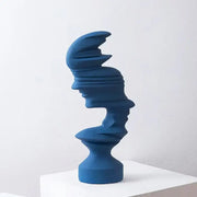 A sleek deep blue ceramic abstract human face sculpture with glossy finish for modern living room decorbites decor