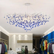Modern blue chrome crystal chandelier with tree branch design featuring blue glass orbs on silver-toned metal arms decorbites chrome crystal