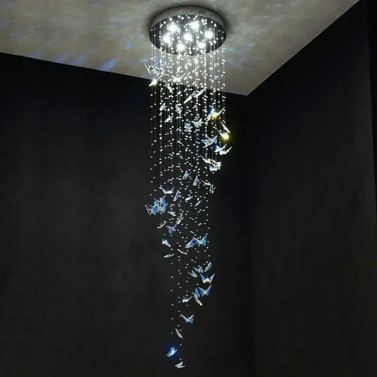 Modern blue and clear butterfly crystal chandelier with circular mount and cascading decorbites butterfly crystals lighting staircase