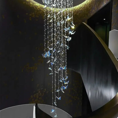 Elegant modern blue and clear butterfly crystal chandelier with cascading strands from golden ceiling fixture decorbites butterfly crystal