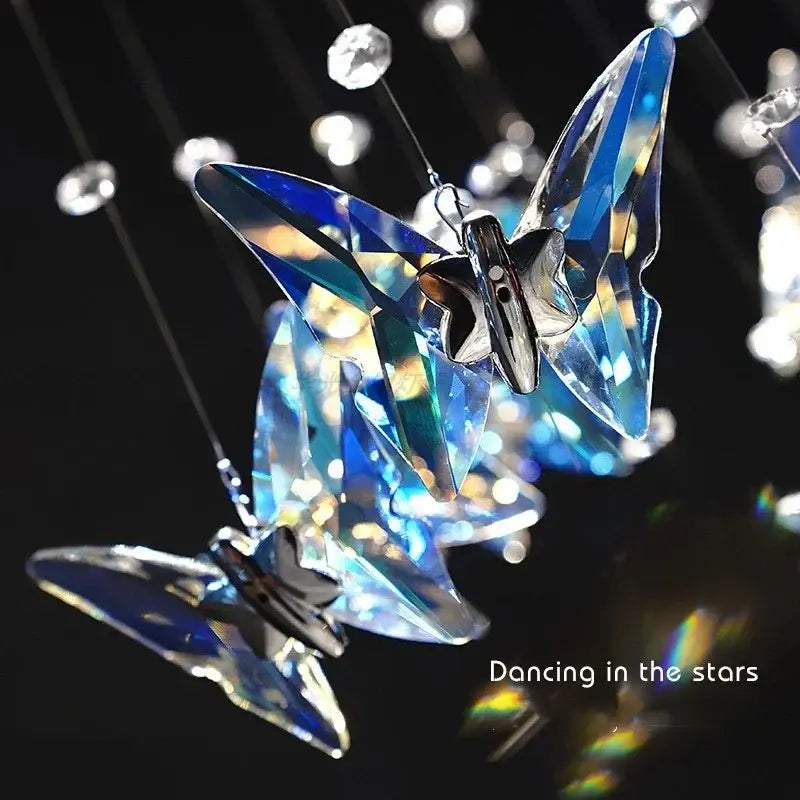 Modern blue and clear decorbites butterfly crystal chandelier featuring iridescent facets and silver-toned metal body