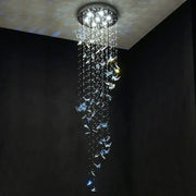 Modern blue and clear butterfly crystal chandelier by decorbites with cascading crystals and bright white lights for staircase decor