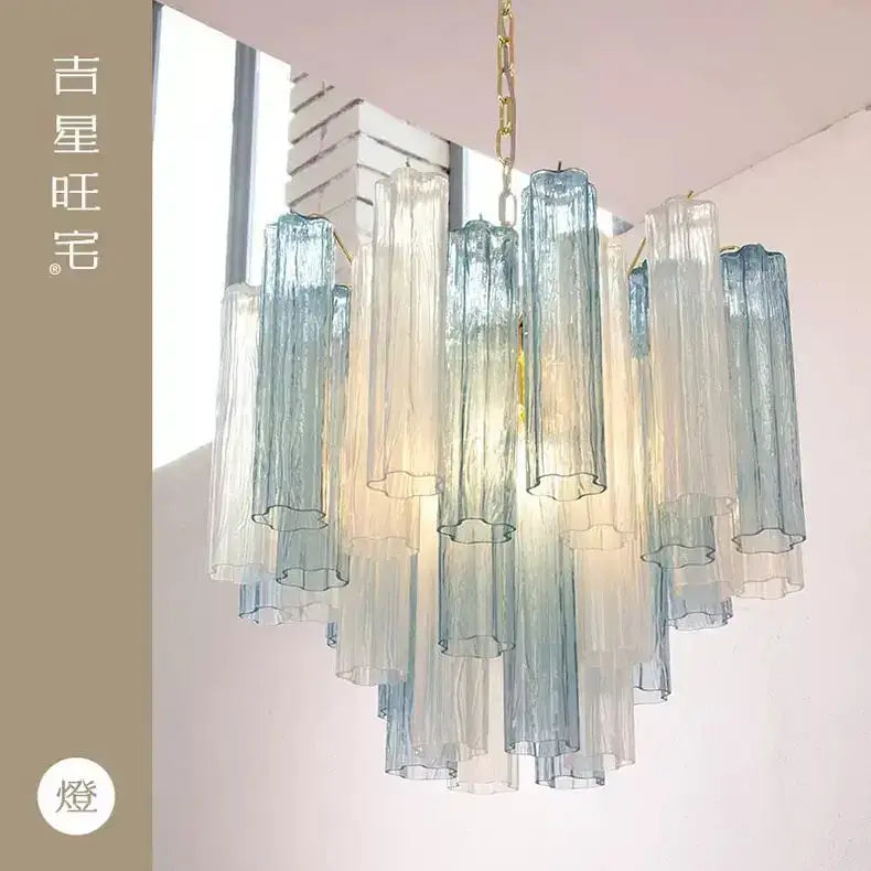 Modern blue and clear colorized glass led chandelier with cascading translucent tubes and gold-toned chain for living room decorbites colorized glass