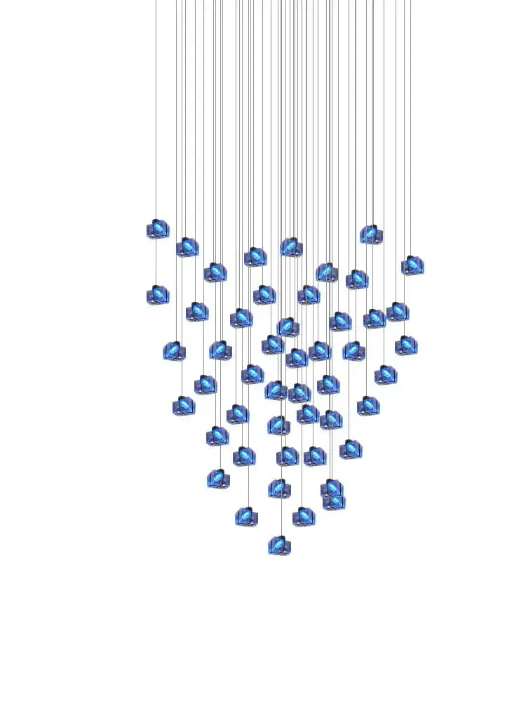A modern blue and clear crystal cube pendant light chandelier with faceted crystals suspended on thin metallic wires