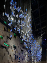 Modern blue and clear crystal cube pendant light chandelier with glowing cubes suspended by metallic wires for living room decorbites crystal cube