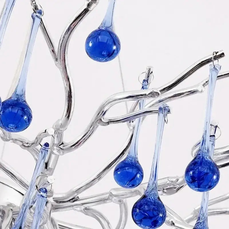 Modern blue crystal led pendant light with blue glass teardrop pendants on a silver frame for living room decorbites blue crystal