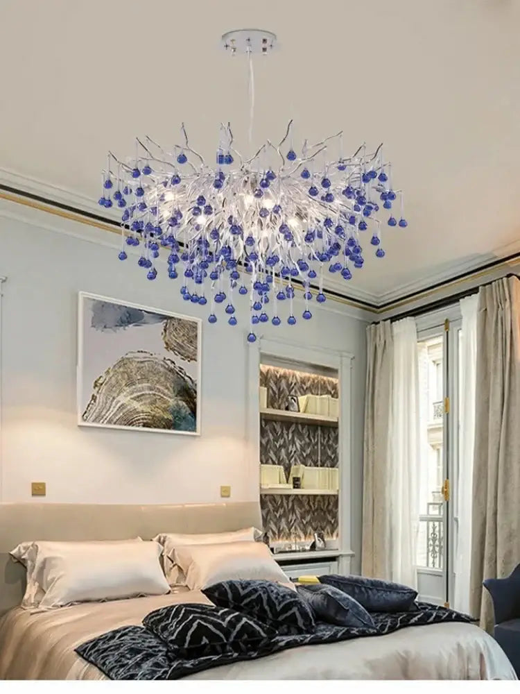 Modern blue crystal led pendant light featuring clear glass stems with clusters of decorbites blue crystal beads