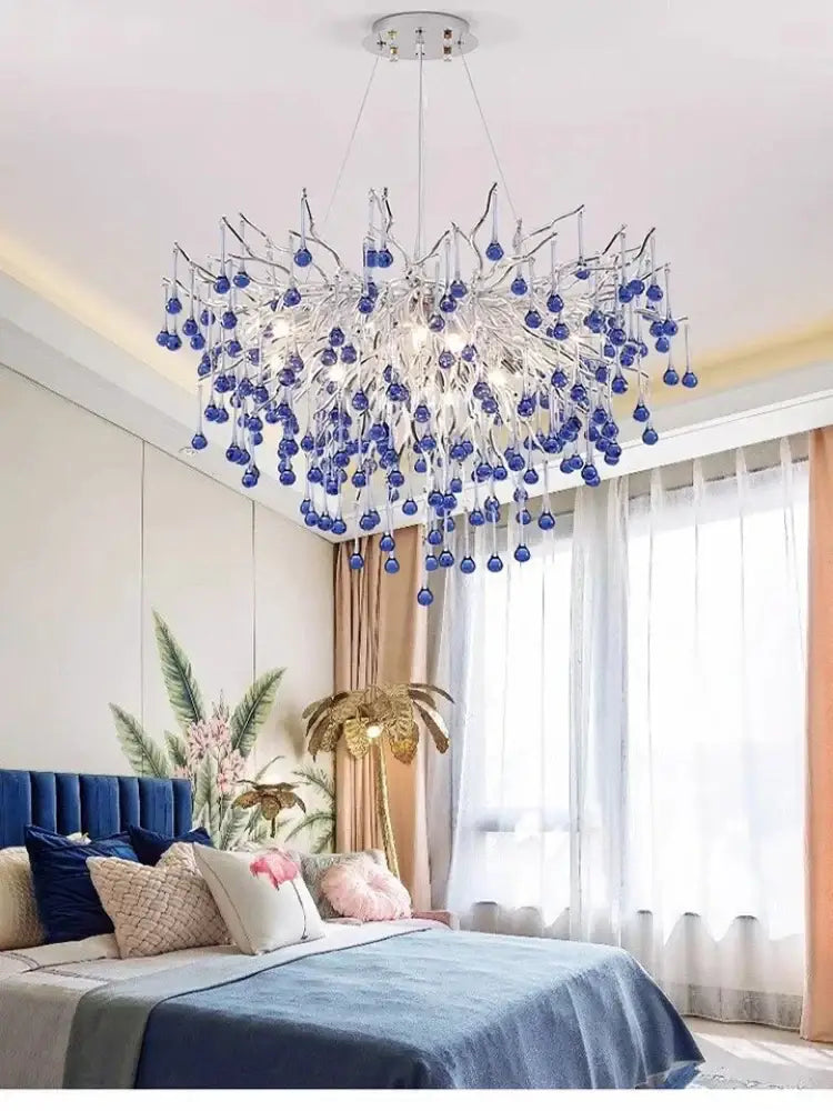 A modern silver metallic pendant light with dangling blue crystal led orbs for living room decorbites blue crystal